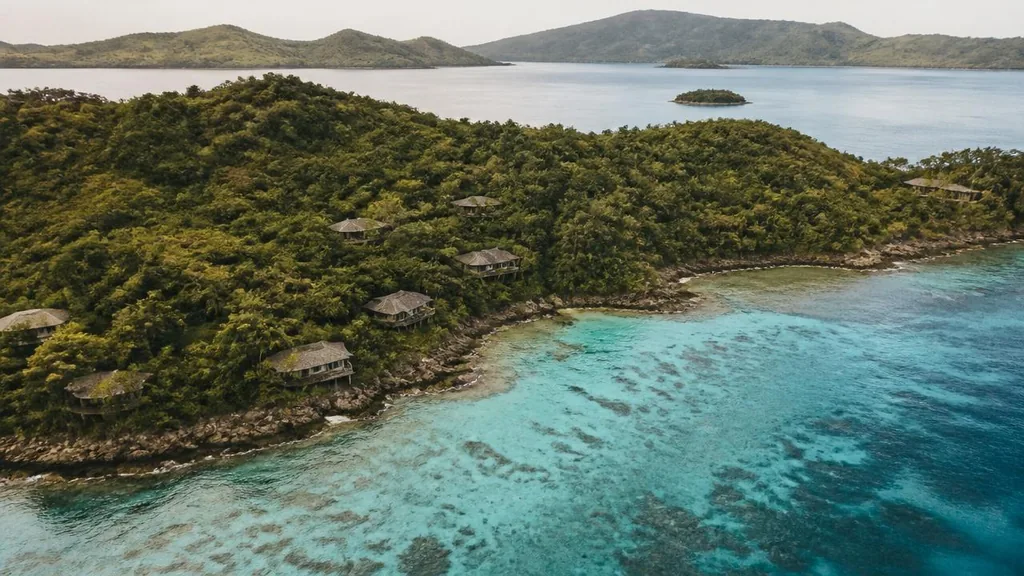 Low-impact villas and reef lagoon across a private Indonesian island group